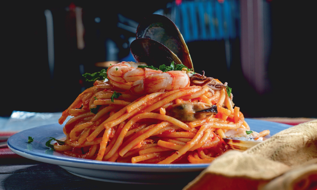 Product image for Que Pasta Italian Restaurant Free appetizer with purchase of two entrees, up to $10 off